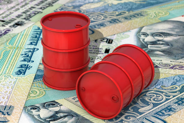 3d illustration: Red barrels of oil lie on background of Indian rupees banknotes, India. Petroleum business, black gold, gasoline production. Purchase sale, auction, stock exchange. 3d illustration: Red barrels of oil lie on background of Indian rupees banknotes, India. Petroleum business, black gold, gasoline production. Purchase sale, auction, stock exchange. oil stock pictures, royalty-free photos & images
