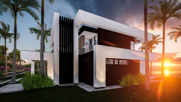 3d rendering of modern house in luxurious style by the sea or ocean on sunset stock photo