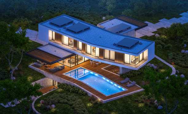 3d rendering of modern house on the hill with pool in night stock photo
