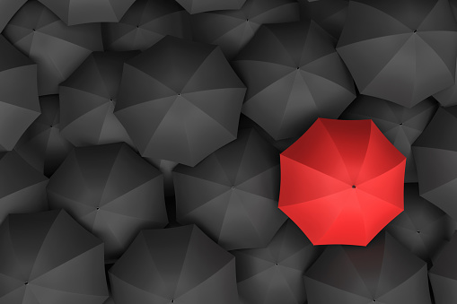 3d rendering of open bright red umbrella towering over an endless amount of similar black umbrellas. Unique outlook. Bright idea. Different opinion.
