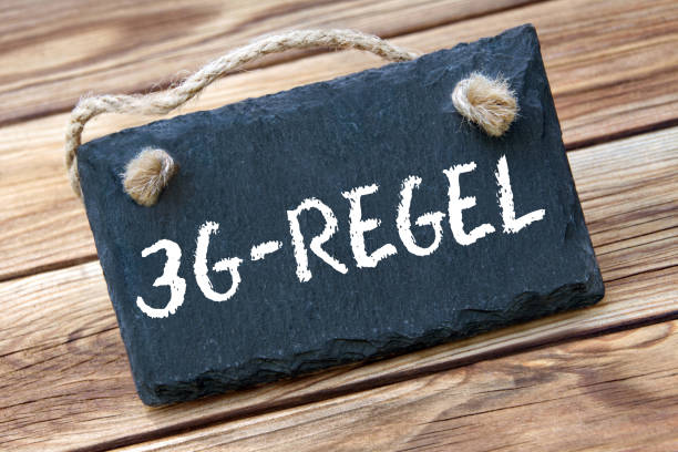 3G-Rule and board on wooden background stock photo