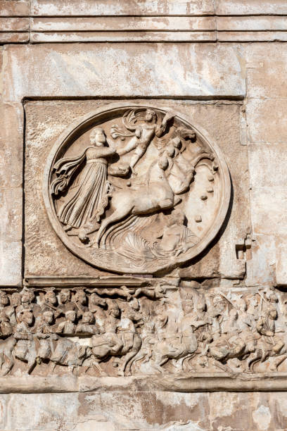 4th century Arch of Constantine, (Arco di Costantino) next to Colosseum, details of the attic, Rome, Italy stock photo