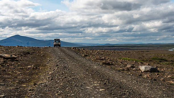 4x4 silouetted against the mountains in Iceland's interior stock photo