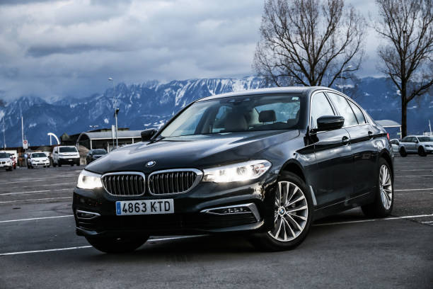 BMW 520d Lausanne, Switzerland - March 11, 2019: Black motor car BMW 520d (G30) in the city street. bmw stock pictures, royalty-free photos & images