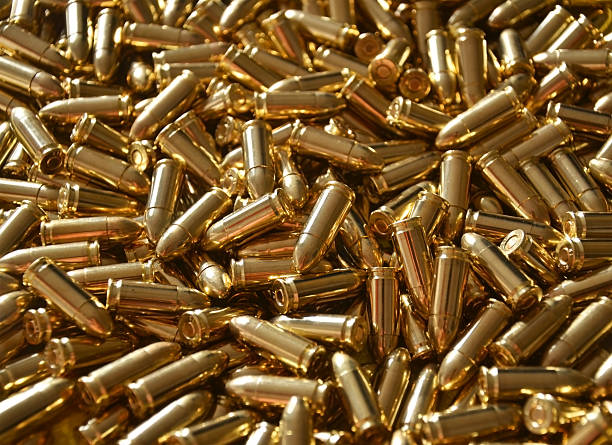 9mm Bullet Ammunition Luger A pile of 9mm bullet ammunition full metal jacket ammunition stock pictures, royalty-free photos & images