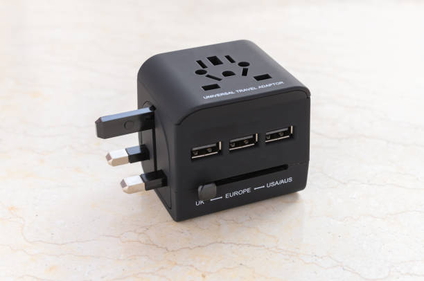 a brand new black universal adapter a brand new black universal adapter plug adapter stock pictures, royalty-free photos & images