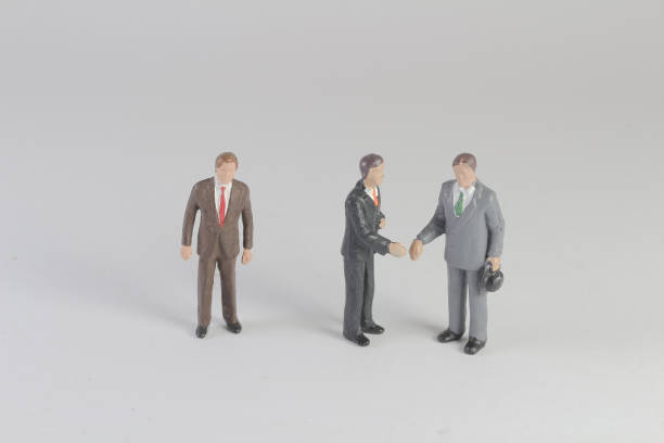 a mini business figure meeting on board the mini business figure meeting on board figurine stock pictures, royalty-free photos & images
