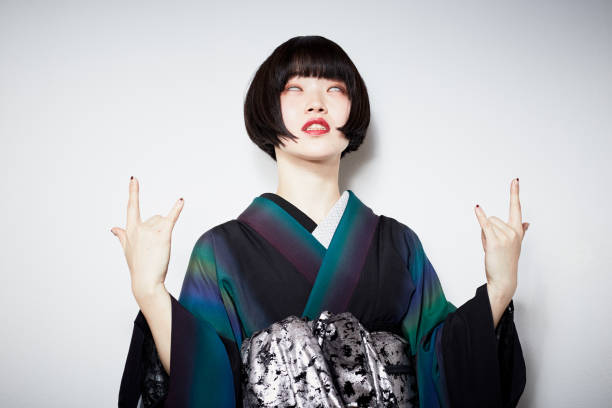 a modern girl in a kimono a modern girl in a kimono japanese girl stock pictures, royalty-free photos & images