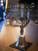 istock a reindeer craving silver bell on modern scandinavian design wooden counter top 1358945982