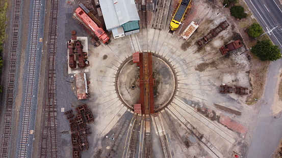 Top down view of a restored historic train turntable and steam engine maintenance and workshop areas, historic Victoria, Australia