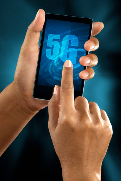 a woman finger connect to 5G network on a smart phone stock photo
