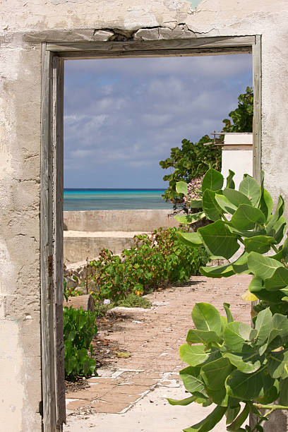 Abandoned Doorway to Caribbean Sea, Looking Through Frame stock photo