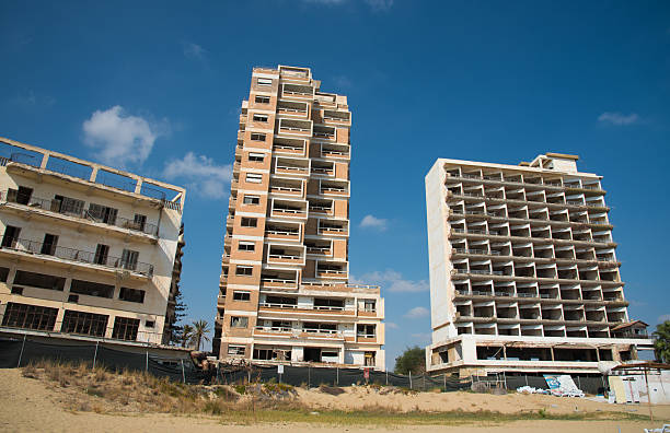 Abandoned hotels Famagusta Cyprus Famagusta, Cyprus - September 15, 2016: Palm Beach and with abandoned hotels at Varosha ghost town, Famagusta, Northern Cyprus varosha cyprus stock pictures, royalty-free photos & images