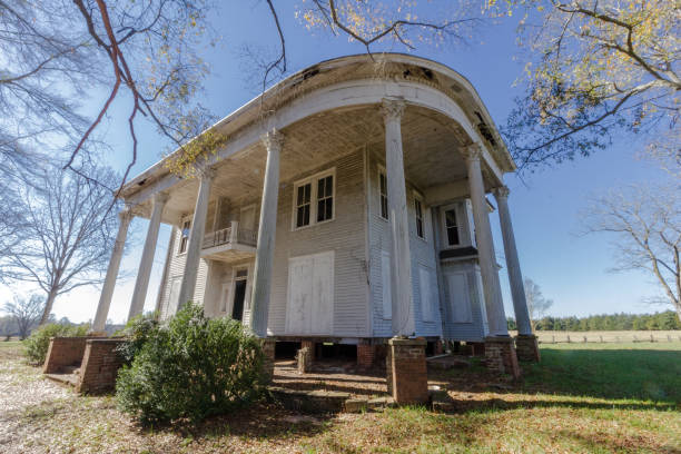 Abandoned plantation home left to rot deep in the south stock photo