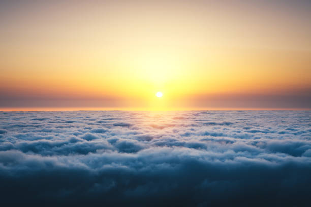 Colorful sunrise above the clouds.