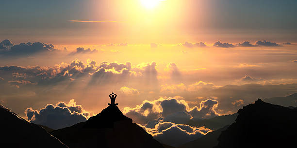 Above the clouds Practicing yoga outdoors. himalayas stock pictures, royalty-free photos & images
