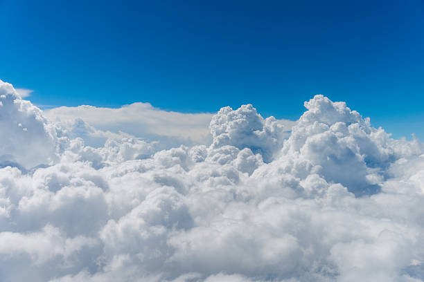 above the clouds puffy clouds and blue sky from above the clouds. cumulus cloud stock pictures, royalty-free photos & images