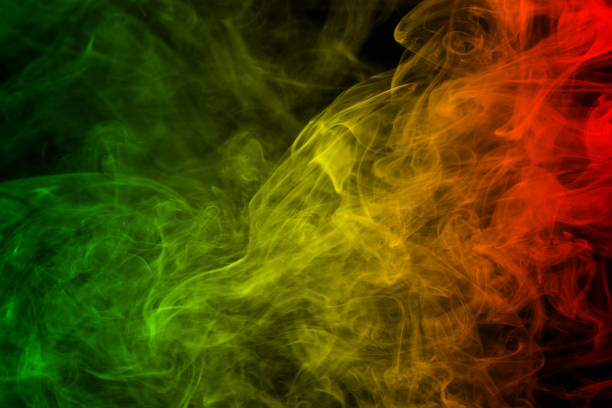 abstract background smoke curves and wave reggae colors green, yellow, red colored in flag of reggae music stock photo