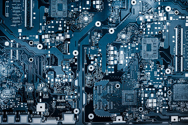 Abstract background with computer circuit board Abstract background with computer circuit board, blue toned image. mother board stock pictures, royalty-free photos & images