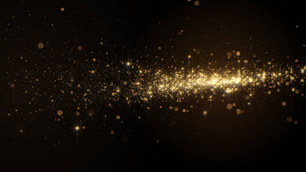 Abstract background with golden light bokeh particles in motion. Beauty and festive concept. glamour stock pictures, royalty-free photos & images
