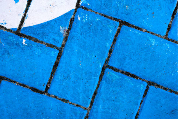 Abstract:  Blue and White painted bricks with dark grout stock photo