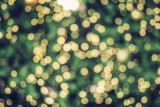Abstract blur decoration ball and light string on christmas tree with bokeh light background.winter holiday seasonal Abstract blur decoration ball and light string on christmas tree with bokeh light background.winter holiday seasonal christmas tree close up stock pictures, royalty-free photos & images
