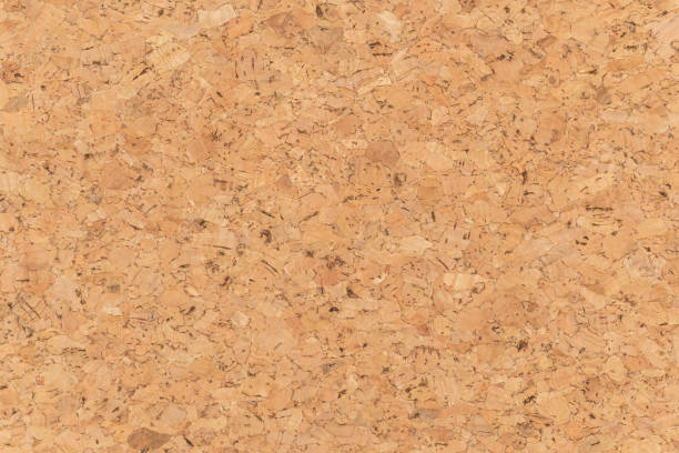 Abstract brown corkboard or cockboard texture background. Natural wood surface for material design element. Beige cork board wallpaper stock photo