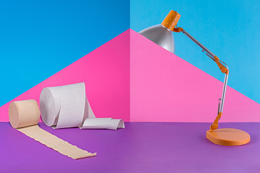 Abstract Collage With Table Lamp And Toilet Paper On A Colored