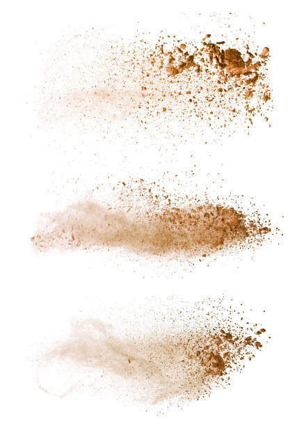 abstrakte farbige braune pulver-explosion isoliert auf weißem hintergrund. - staub stock-fotos und bilder