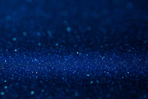 Abstract dark vivid navy blue sparkling glitter wall and floor perspective background studio with blur bokeh.luxury holiday backdrop mock up for display of product.holiday festive greeting card. stock photo