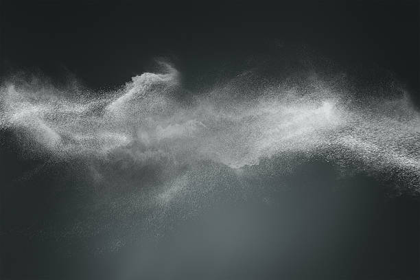 Abstract dust cloud design Abstract design of white powder cloud against dark background particle stock pictures, royalty-free photos & images