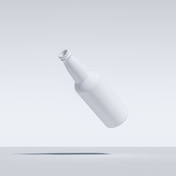 Abstract Image of White Painted Beer Bottle, Floating, Flying, Suspended In Mid Air, Isolated Against White stock photo
