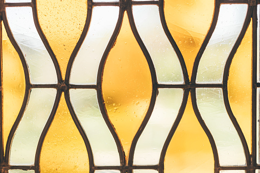 Abstract image of yellow-white stained glass window