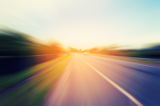 Abstract motion blur of the road with sunlight