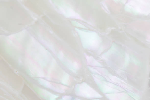 Abstract pearl background with soft shimmering mother of pearl lilac and rainbow colours stock photo