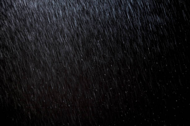 abstract rain texture background. background rain in night light stock photo