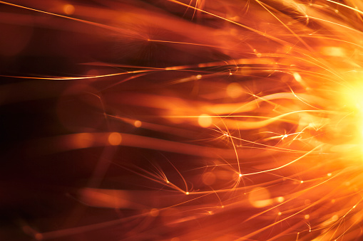 Macro photography of sparks. Great background image for party, celebration or technology.