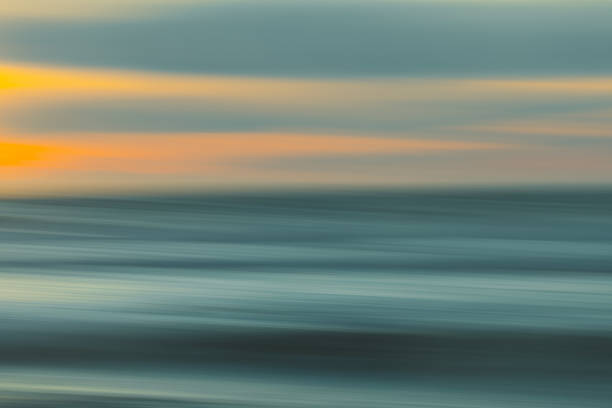 Abstract seascape. Image displays blue, yellow, and light turquoise split-toned color scheme. stock photo