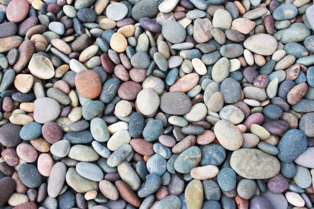 Abstract smooth round pebbles background stock photo