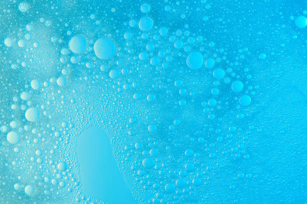 Abstract soap foam bubbles Abstract soap foam bubbles on blue flat background. Washing liquid surface frothy drink stock pictures, royalty-free photos & images