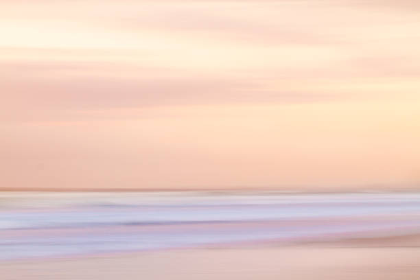 Abstract sunset sky and ocean background with blurred motion stock photo