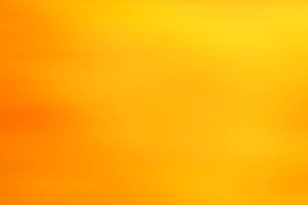 abstract warm yellow background motion blur stock photo