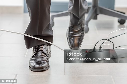 istock accident in the office with the cable 1313633321
