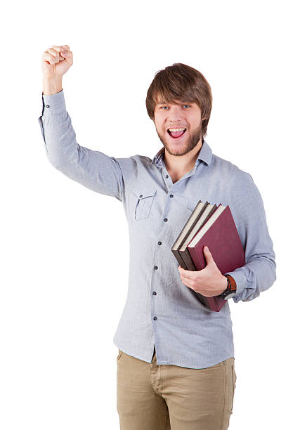 accomplished young man with books stock photo
