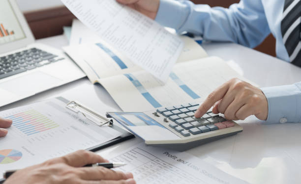 accounting audit financial Auditor team checking in financial statement for audit internal control system. Accounting , Accountancy, Bookkeeping Concept. coins calculator stock pictures, royalty-free photos & images