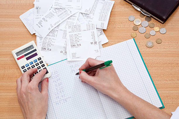 Accounting flat lay with calculator, money and receipts stock photo