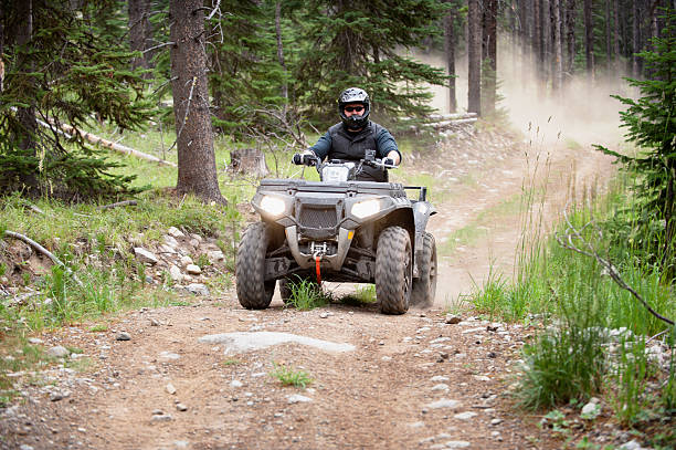 ATV Action atv action / riding around having fun / motion blur on wheels off road vehicle stock pictures, royalty-free photos & images