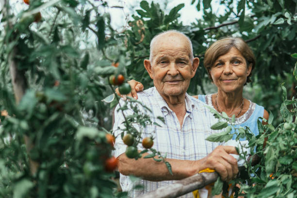Active couple gardening stock photo