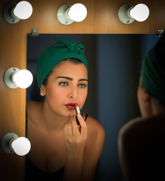 Actress Applies Makeup Backstage Actress Applies Makeup Backstage actress stock pictures, royalty-free photos & images