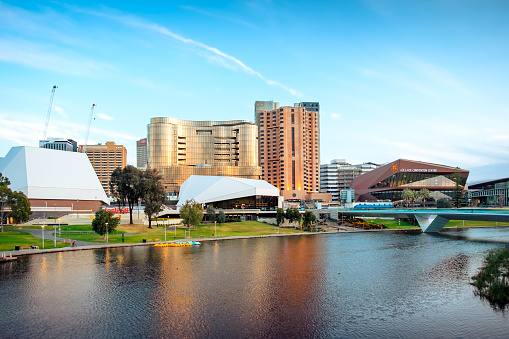 Adelaide, South Australia - September 7, 2020: Adelaide CBD skyline with the new Skycity casino building viewed across Torrens river at sunset time